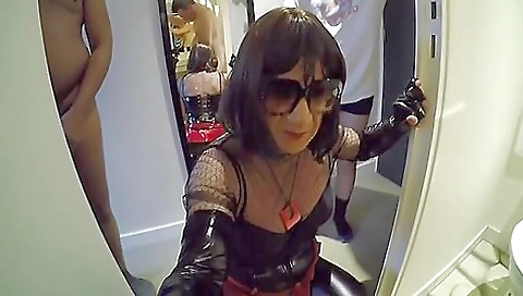 A guy fucks a brunette and a shemale in the ass in a threesome