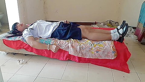 Busty schoolgirl wearing a school uniform for a cosplay