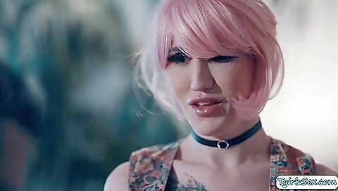 A tranny with a tattooed tits is fucked hard in bed